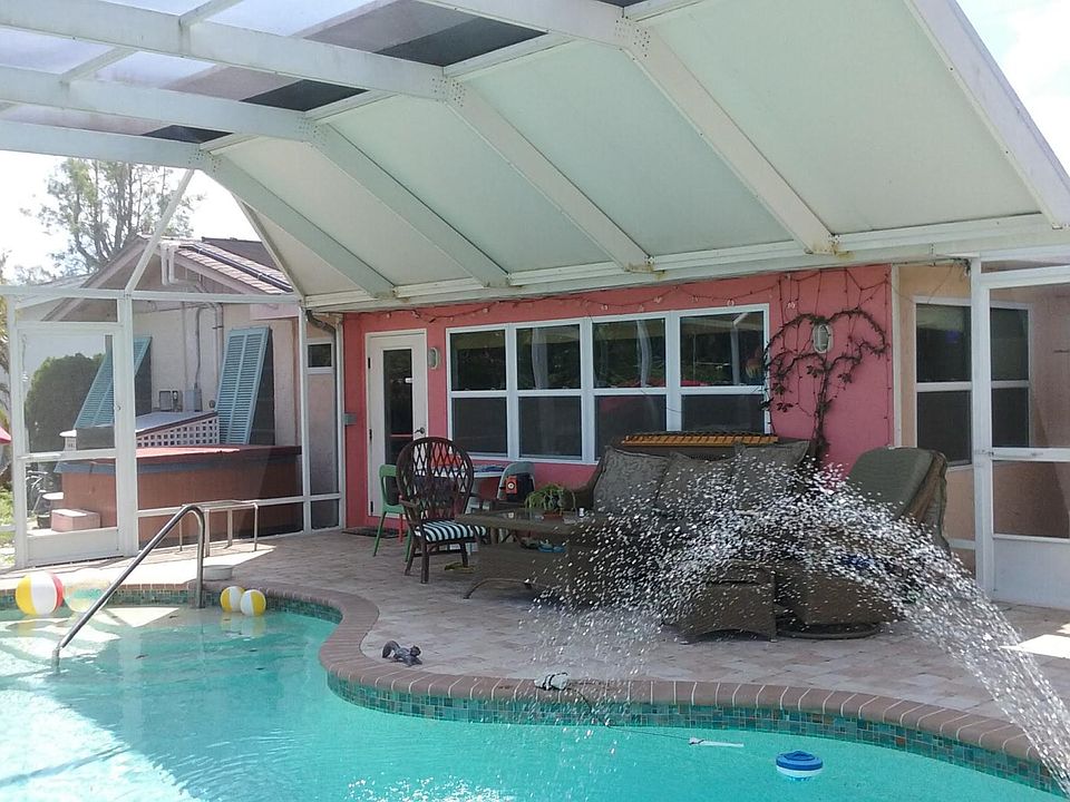 Deck seating to the right door leads to outside shower area and grill.