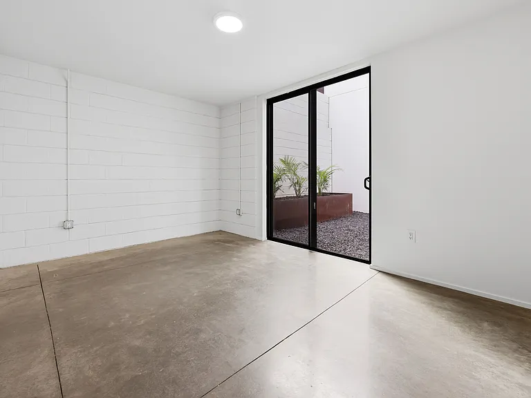 1st Floor Bedroom with attached Patio access and attached bathroom.