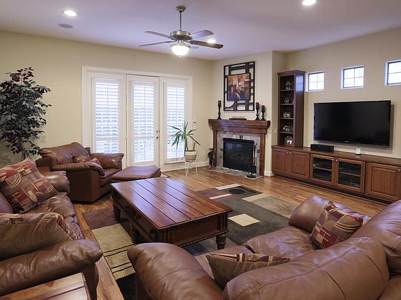 Living Room: Includes built in shelves and French doors to the fenced patio