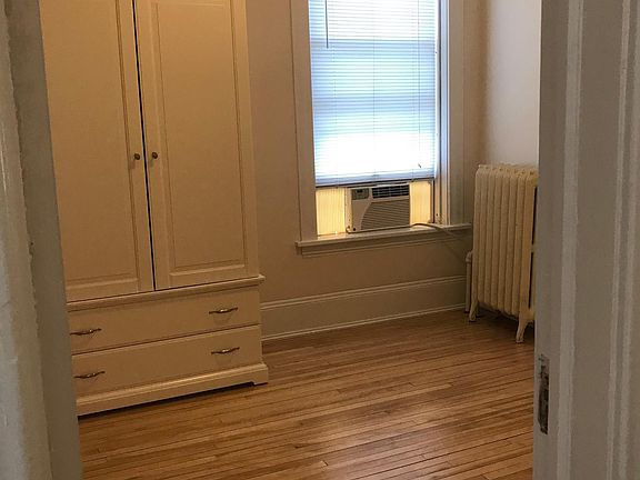 Bedroom 9_ 6_ x 12_ big enough for a queen bed. With a moveable Ikea closet system