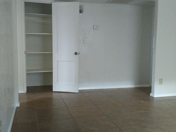 Living room angle showing hall closet