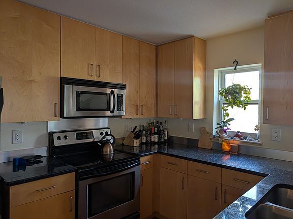 The bright, airy kitchen has lots of counter space and storage.