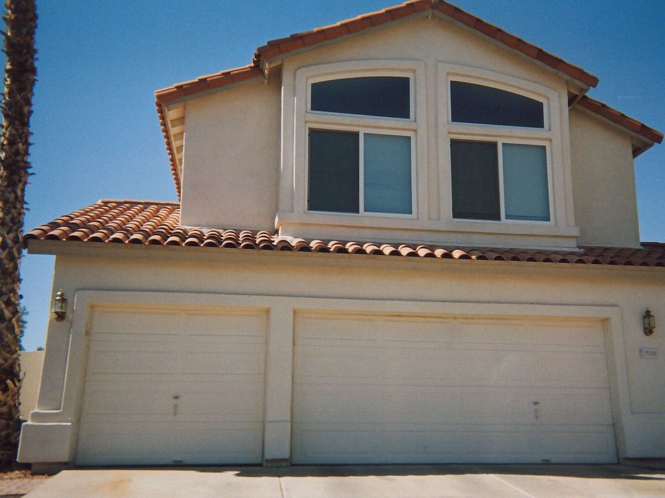Front view, 3 car garage