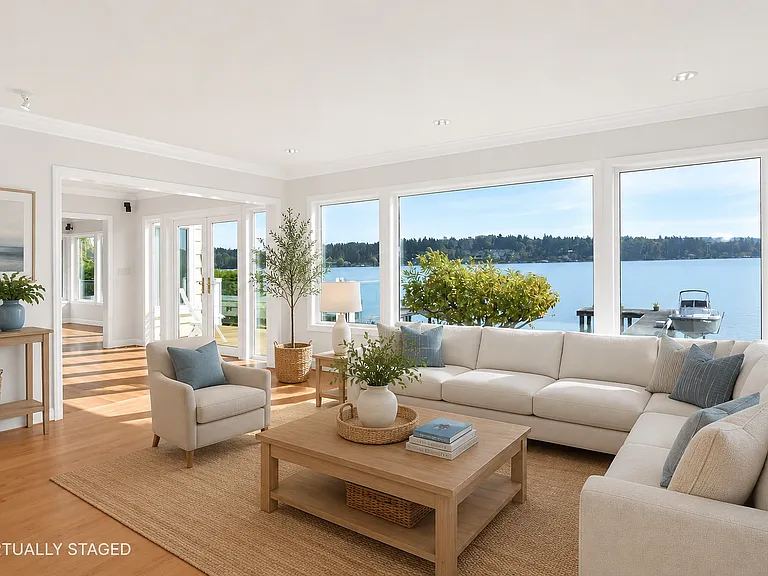 Walls of glass bring the lake into the heart of the home.
