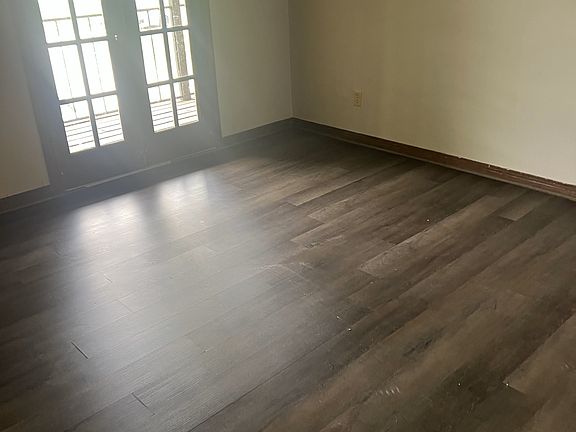 Front bedroom with doors to balcony