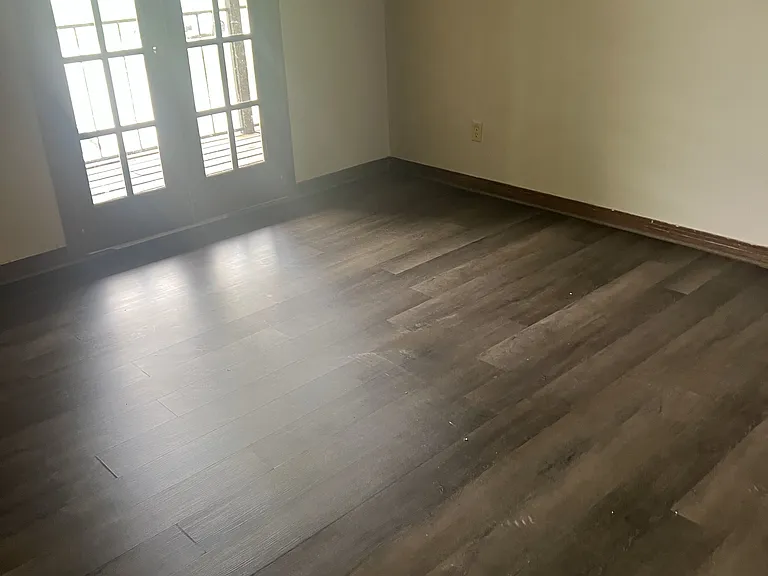 Front bedroom with doors to balcony