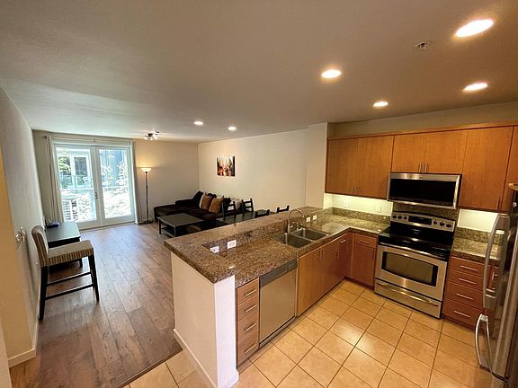 Enters into to the open concept kitchen -overseeing dining and living room area