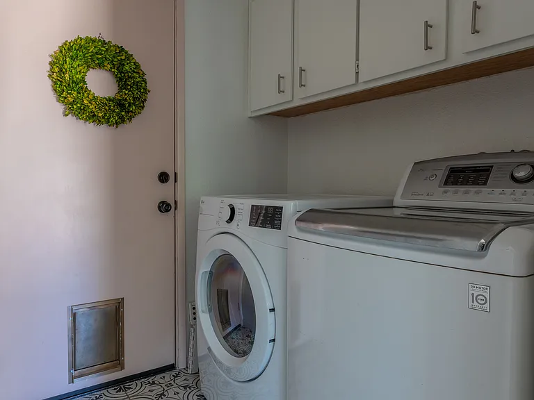 Washer and dryer on lower level as you enter into the garage