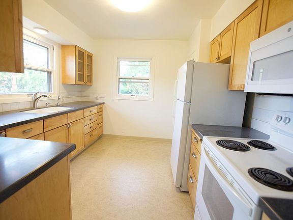 Kitchen with Quartz Countertops and full size appliances