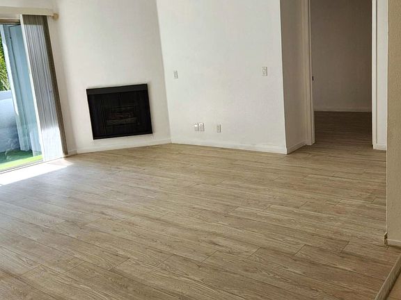 Spacious living room with large private balcony