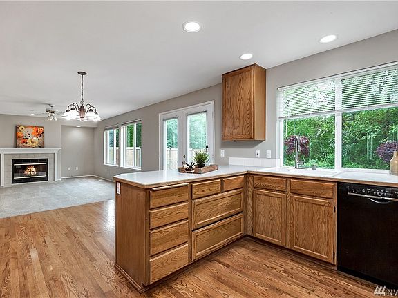 Kitchen overlooks breakfast nook and family room