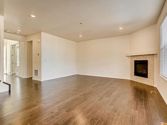 Spacious and open with high ceilings. Nice custom fireplace.