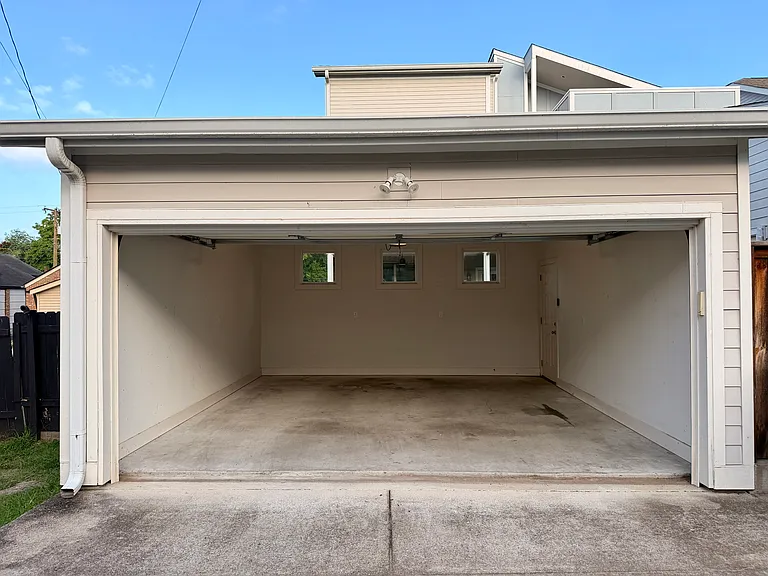 Garage entry to access the privately fenced-in backyard