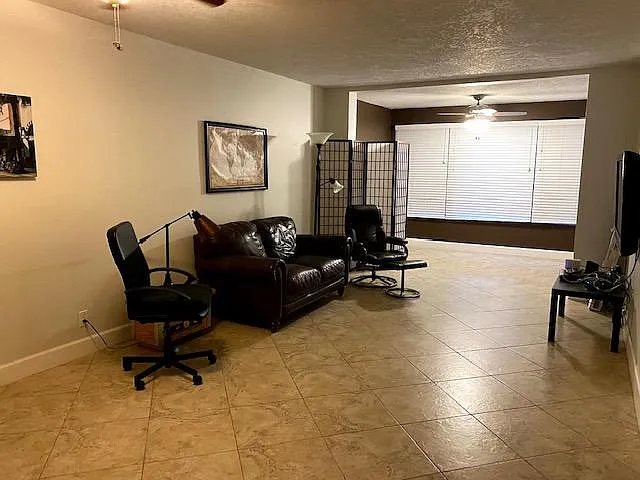 Space for home office is just off the living room, with a lovely large window that opens up to a waterfront view.