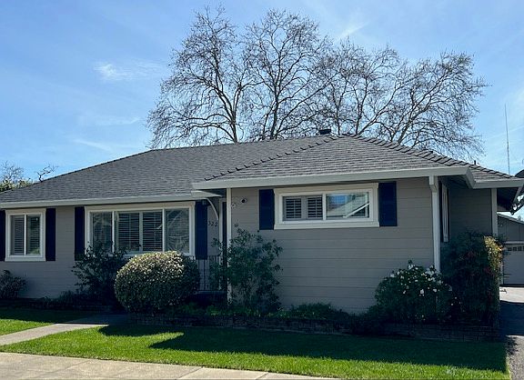 Front of home with driveway to the west