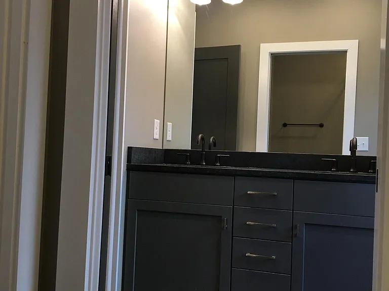 2nd story shared bathroom goes with the two side by side bedrooms - 2 sinks and 2 linen closets ideal for housemates.