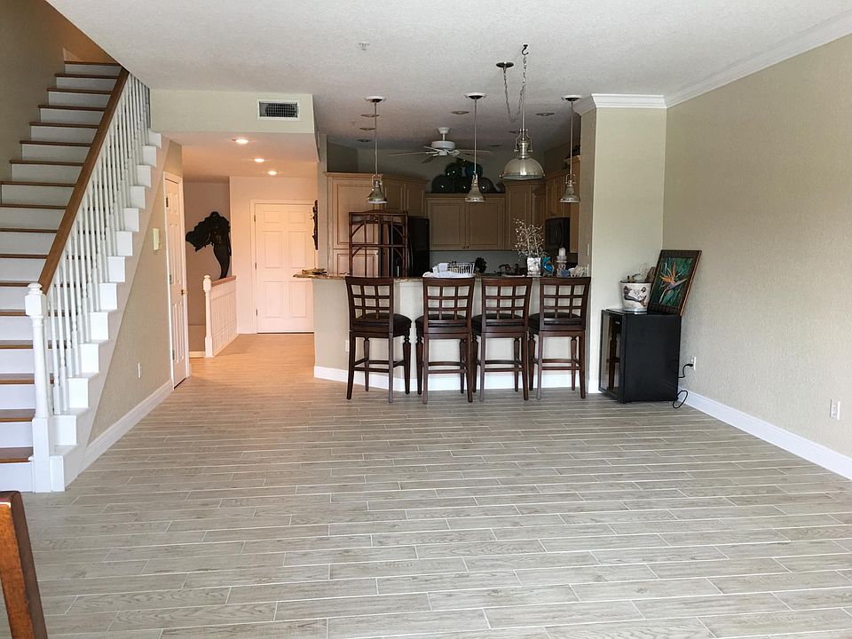 Dining room and part of living room that faces canal and boat slip.