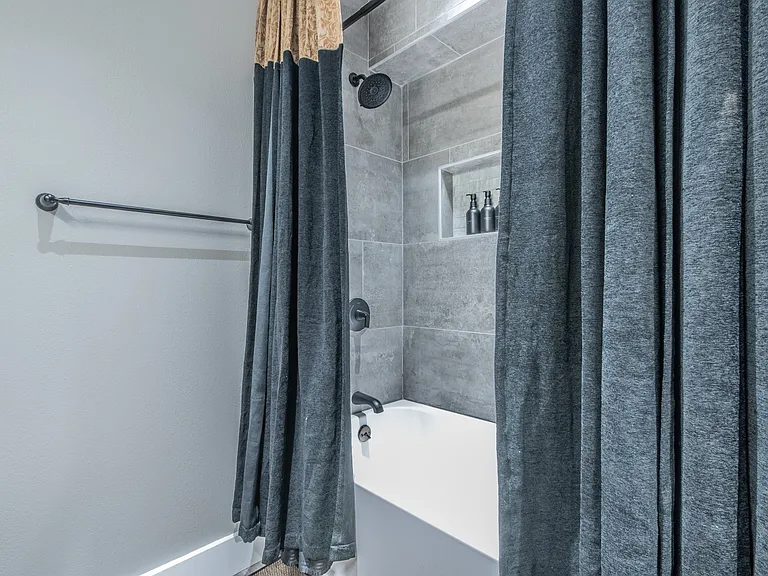 Refresh in the sleek tiled shower and soaking tub.