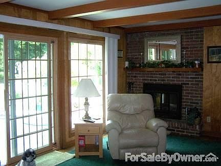 Family Room (19' X 13')
						:
						Has a wood burning fire place with hardwood floors and a sliding door to deck.