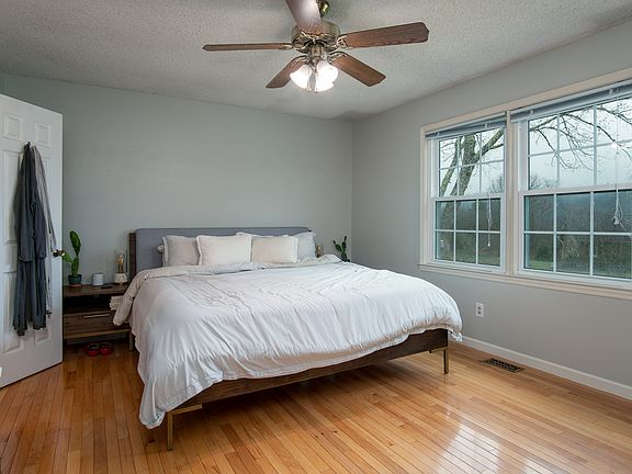 Primary Bedroom with Ensuite Bathroom and Walk-In Closet