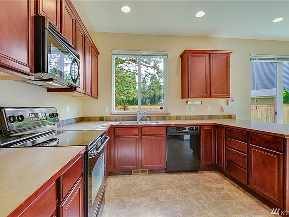 Spacious kitchen with appliances included.