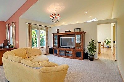 Another view from the entry looking into the kichen and family room space. The vaulted ceilings exte