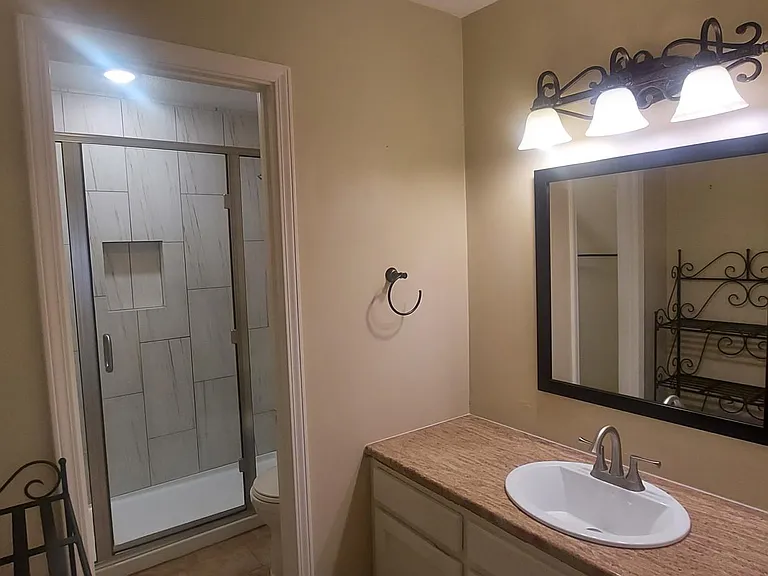 Master bath with separate sink & vanity area.