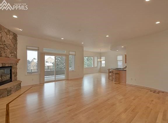 The great room has beautiful cherry inlaid maple wood floors throughout most of the main level.