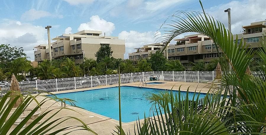 Recreational area view with the apartment building in the ba