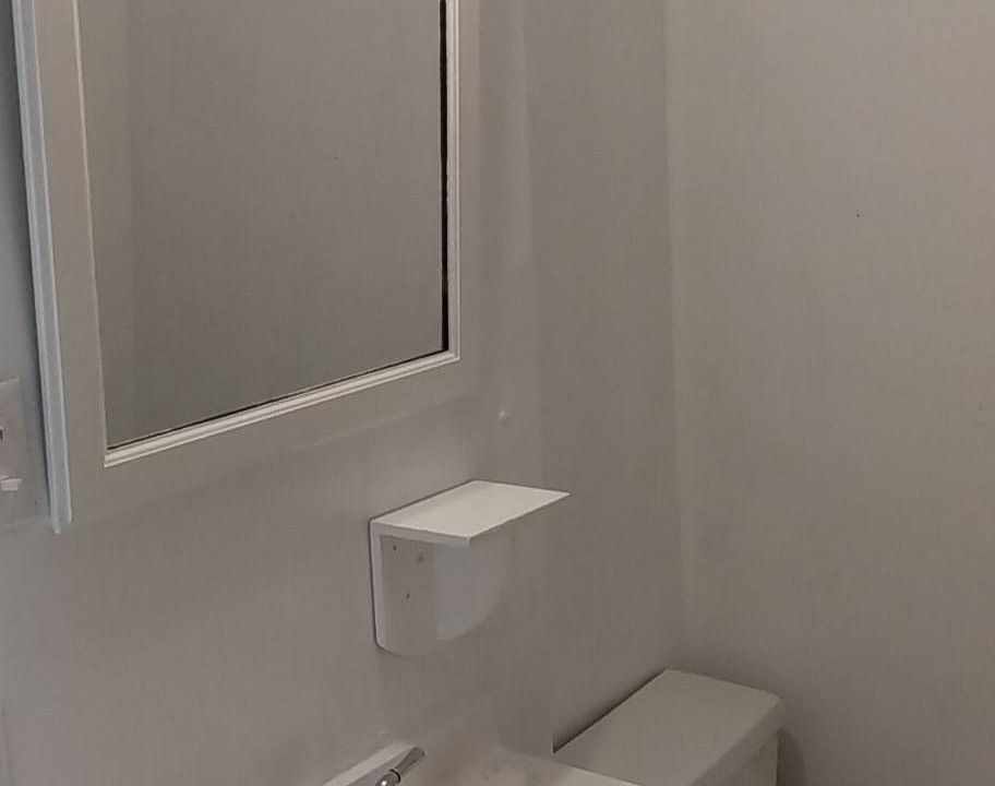 Bathroom with stall shower.