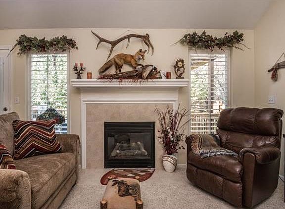 The gas fireplace logs warm you when it's cold outside.