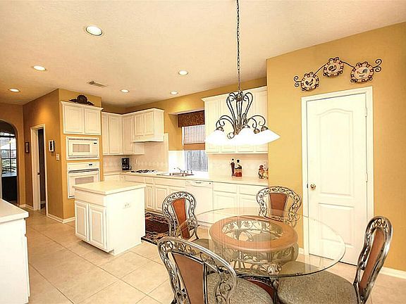 From the Breakfast room into the kitchen. Open for easy conversation and entertaining.