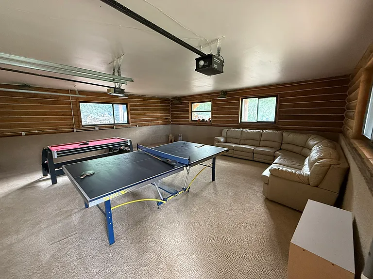 Game room on lower level of converted garage.