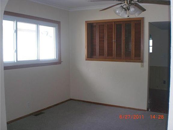 dining room with with pass through opening into kitchen