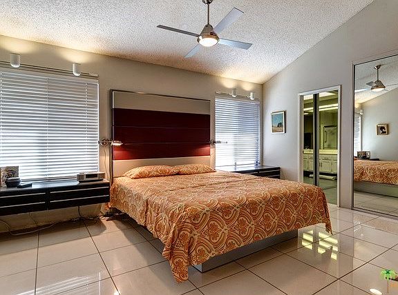 Large master bedroom with high ceilings