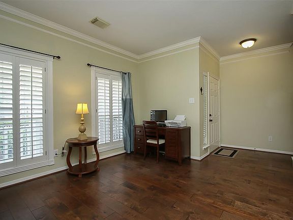 When you walk into the entryway to the right is a very open formal living room, which could also be used as a study. Plantation 