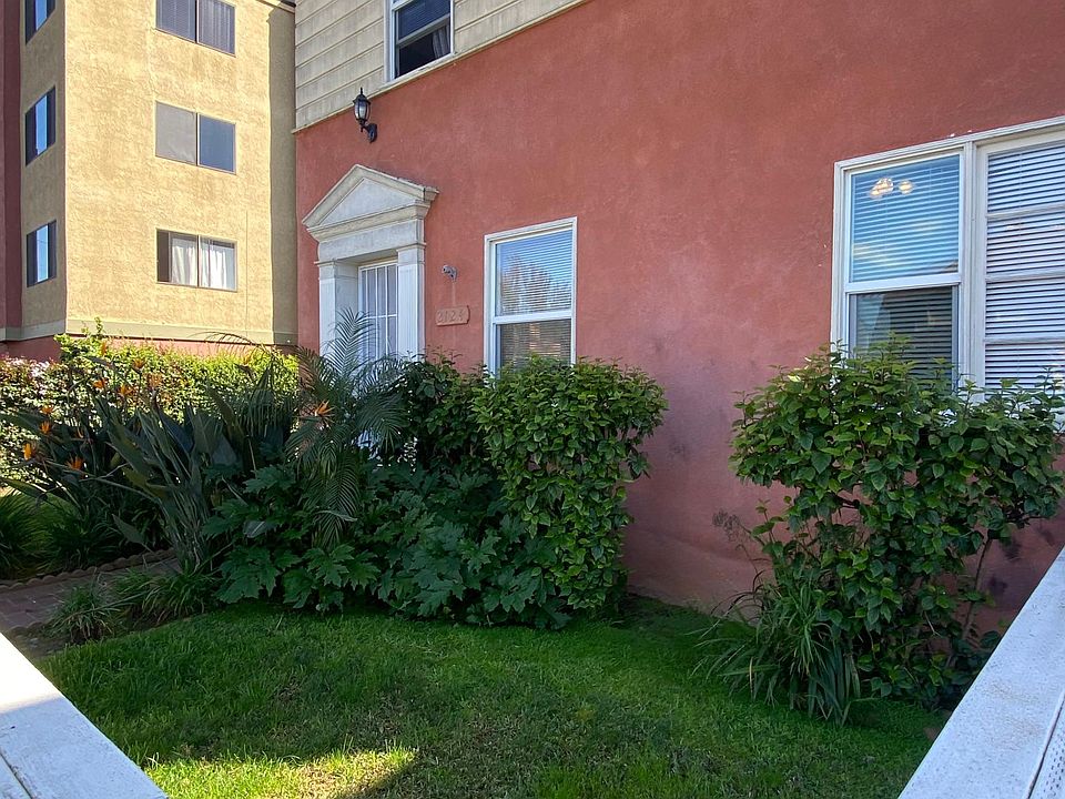Small grassy area out front and behind a fence adjacent to the front door.