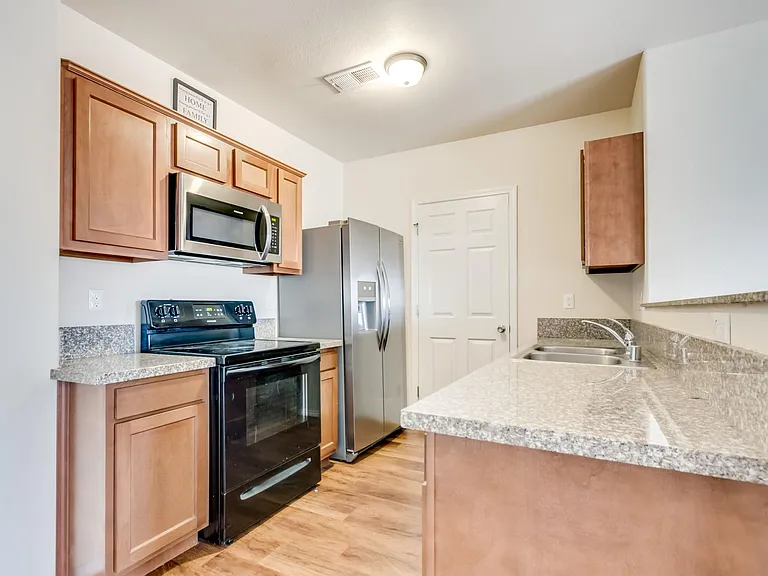 Kitchens have granite countertops.