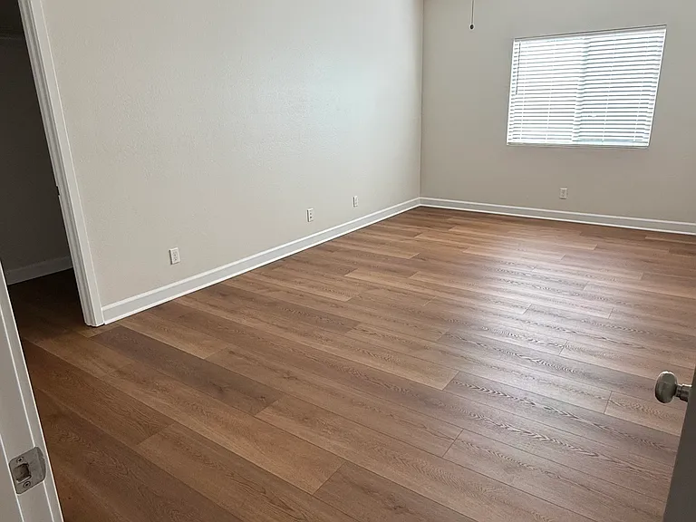 Bedroom Upstairs with laminate wood flooring