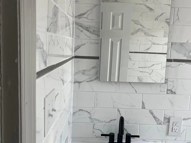 all faux marble bathroom from walls to floors.