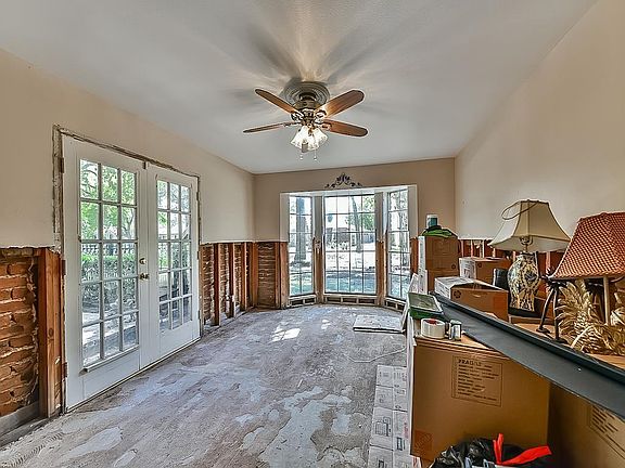 Formal Living room with bay window & French doors to front patio, both providing an abundance of natural light.
