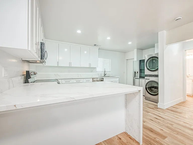 Luxury Kitchen & Appliances, LVP Flooring, Quartz Countertops, Central Heating & Cooling, New Windows.