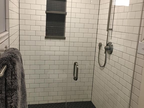 Tiled Shower with glass door & recessed shampoo niche 