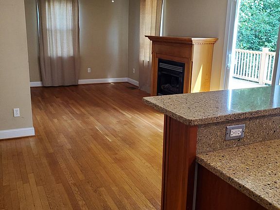 View from kitchen into living room with gas fireplace