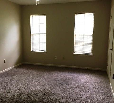 Downstairs bedroom with a full bath