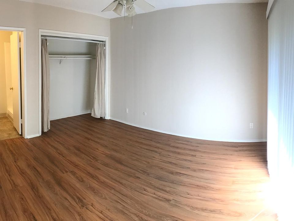 Master bedroom with attached bathroom and patio.