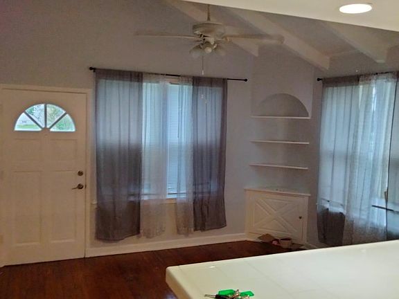 Kitchen opens up to living room.