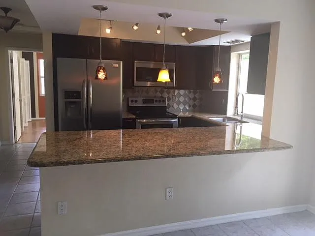 large open kitchen with granite countertops