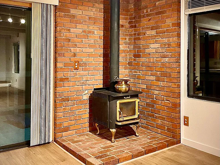 WOOD BURNING FIREPLACE AND GAS WALL FURNACE