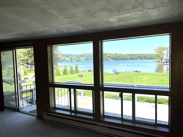 View of the lake. Slider doorway to the deck.